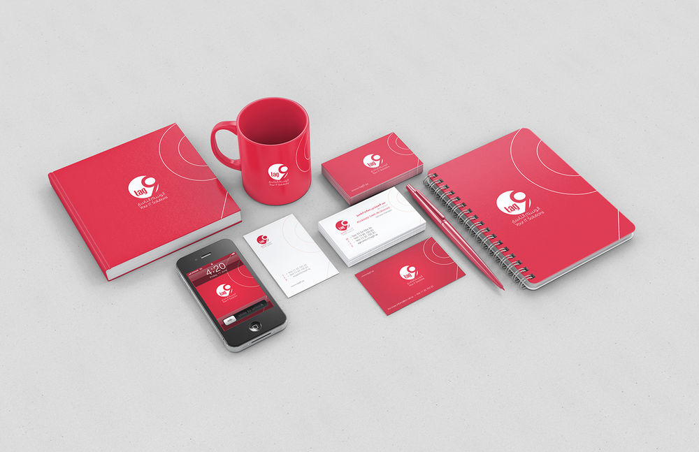 Red brand identity mockup with mug, cards and stationery